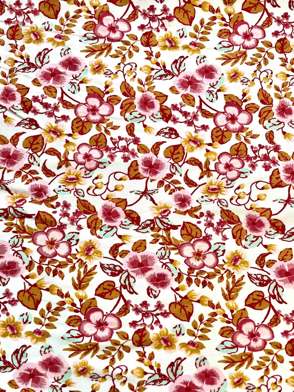 Modaljersey mit romantischen Blumen in Beere&Ocker Modaljersey mit romantischen Blumen in Beere&Ocker