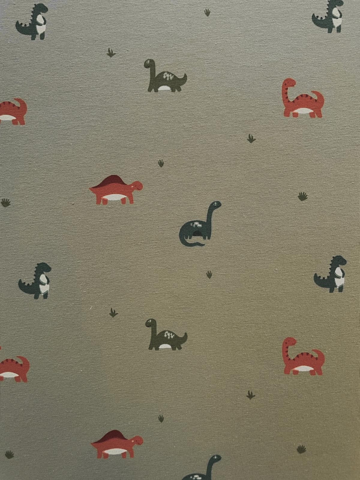 Jersey-Stoff als Meterware mit Dinosaurier-Print in Grün für Kinderbekleidung