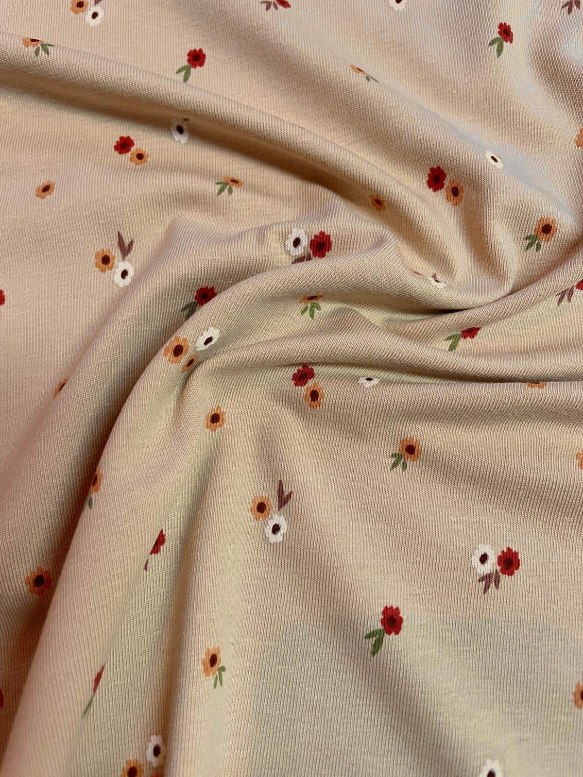 Baumwoll- Jersey mit kleinen Blumenmuster beige Baumwoll- Jersey mit kleinen Blumenmuster beige