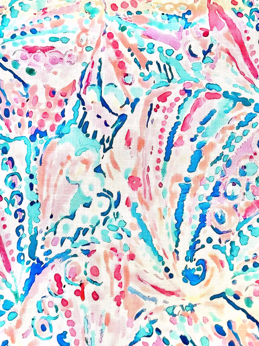 Hochwertiger, stretchig-weicher Viskosestoff mit einem lebhaften, abstrakten Muster aus Punkten und Linien in Türkis, Koralle, Pink und Blau auf hellem Hintergrund.