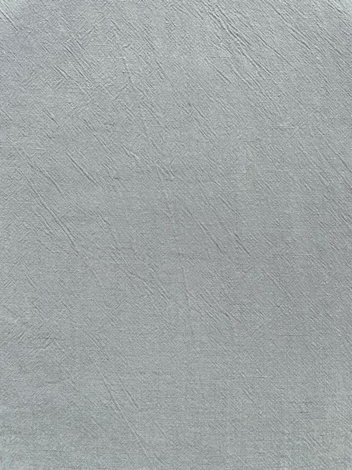 Nahaufnahme von grauer Kochbaumwolle mit grober Webstruktur aus 100% Baumwolle, 135 cm breit, ideal für strapazierfähige Küchentextilien und Brotkörbe.