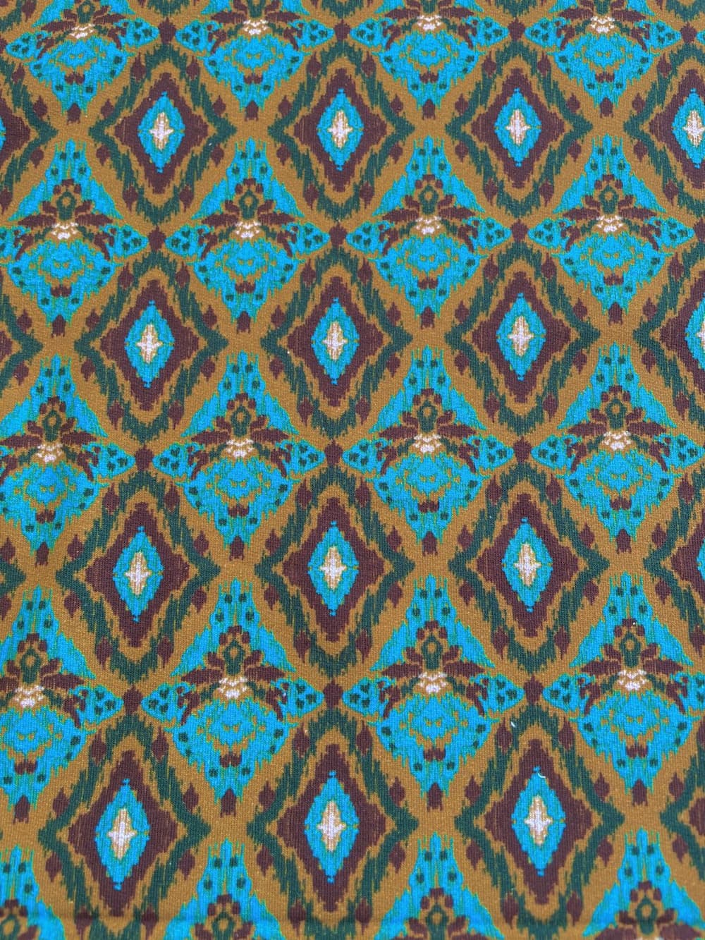 French Terry – Ikat-Muster in Gold & Türkis/Weinrot French Terry – Ikat-Muster in Gold & Türkis/Weinrot