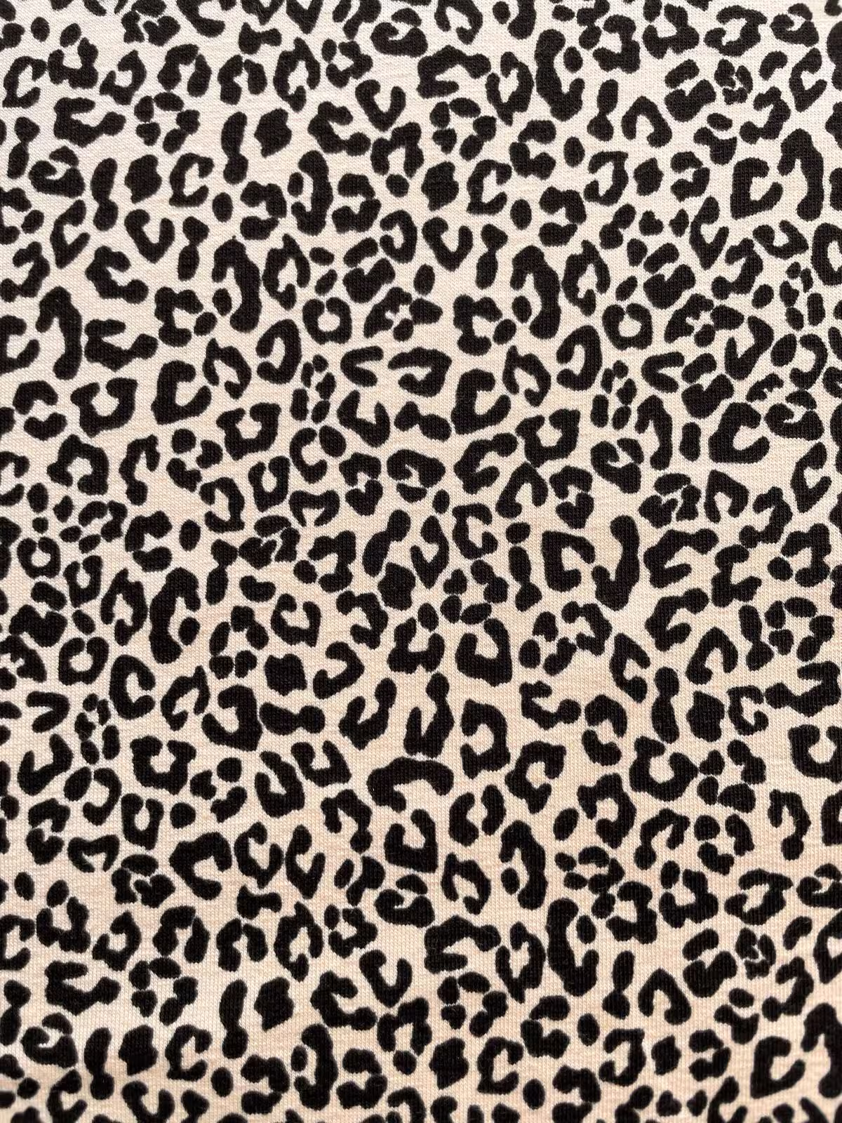 Baumwolljersey Stoff als Meterware mit Leopardenmuster in Beige und Schwarz