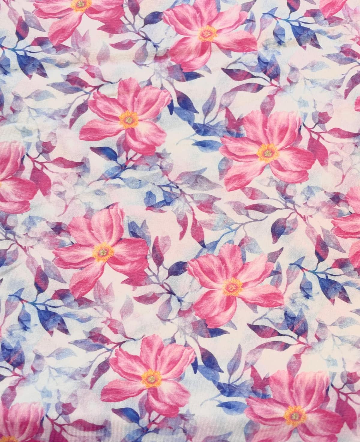 Jersey Meterware Stoff mit floralem Muster in Rosa und Blau auf hellem Grund für Bekleidung