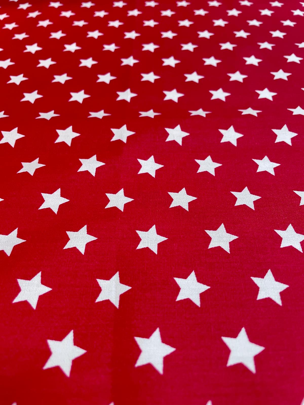 Beschichtete Baumwolle "Sternenglanz" rot mit weißen Sternen