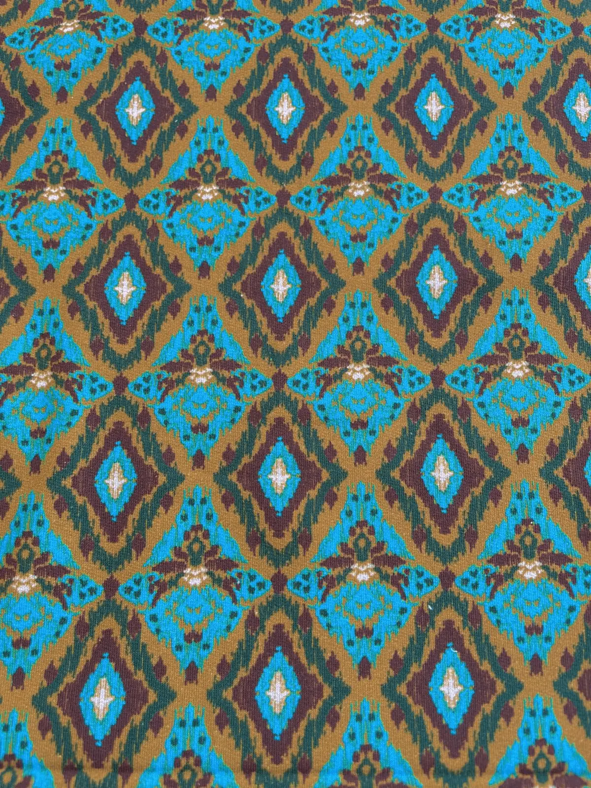 French Terry – Ikat-Muster in Gold & Türkis/Weinrot