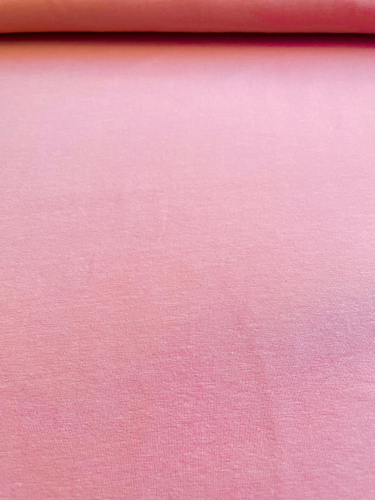 Nahaufnahme von elastischem Jersey-Stoff in der Farbe Melone Rosé mit feiner Maschenstruktur.