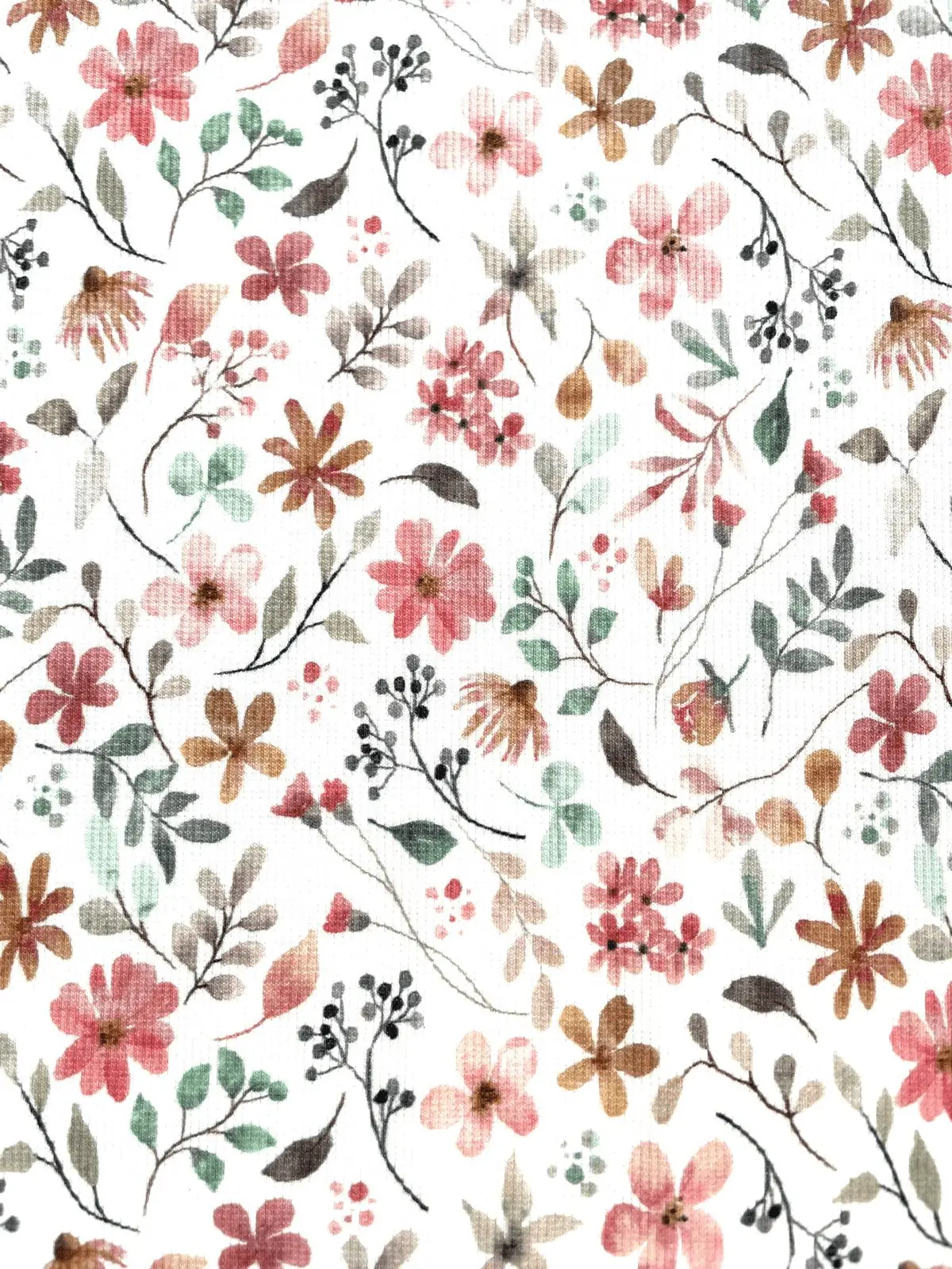 Weicher Rippjersey-Stoff mit filigranem Blumenmuster in Pastelltönen wie Rosa, Gelb und Grün auf weißem Grund.