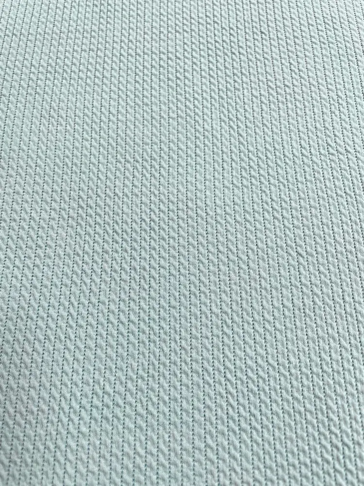 Jacquard-Jersey in Mint mit eingewebtem Zopfstrick-Muster – weicher Strukturstoff für Cardigans