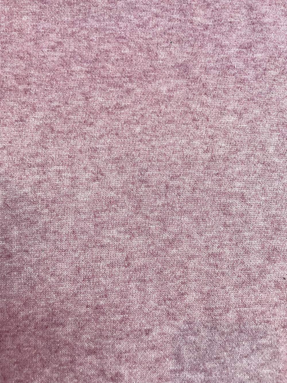 Weicher Feinstrick Stoff in Altrosa Melange, elastische Wirkware mit feinem Maschenbild für herbstliche Bekleidung.
