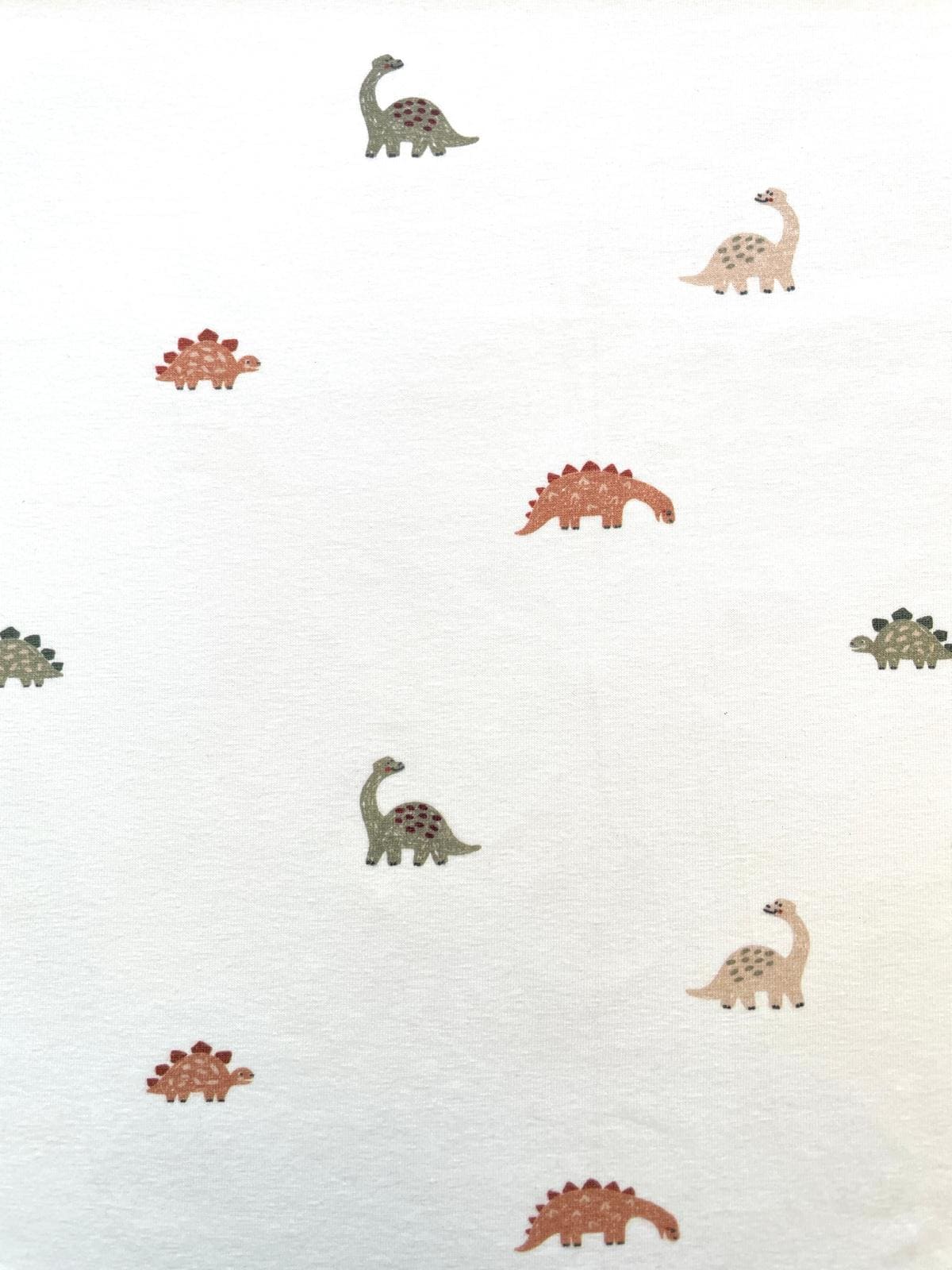 Baumwolljersey: Kleine Dinos auf Creme Baumwolljersey: Kleine Dinos auf Creme
