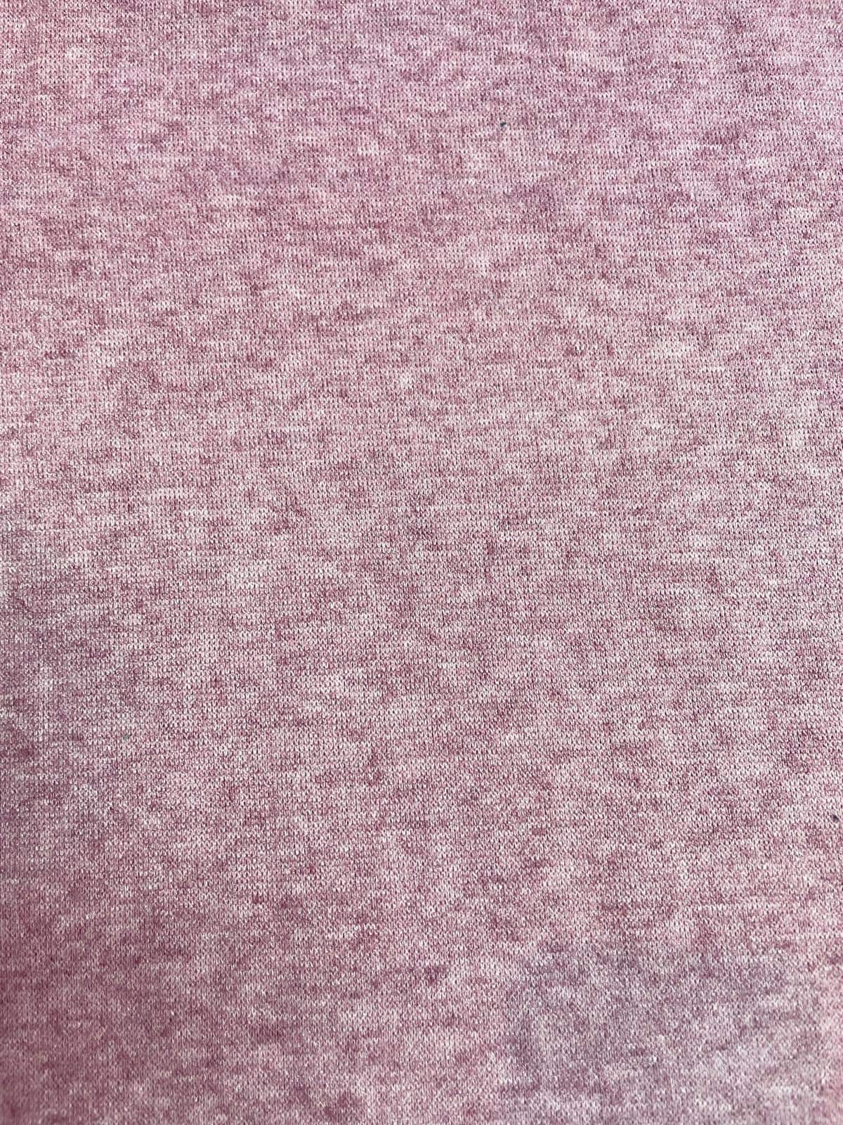Weicher Feinstrick Stoff in Altrosa Melange, elastische Wirkware mit feinem Maschenbild für herbstliche Bekleidung.