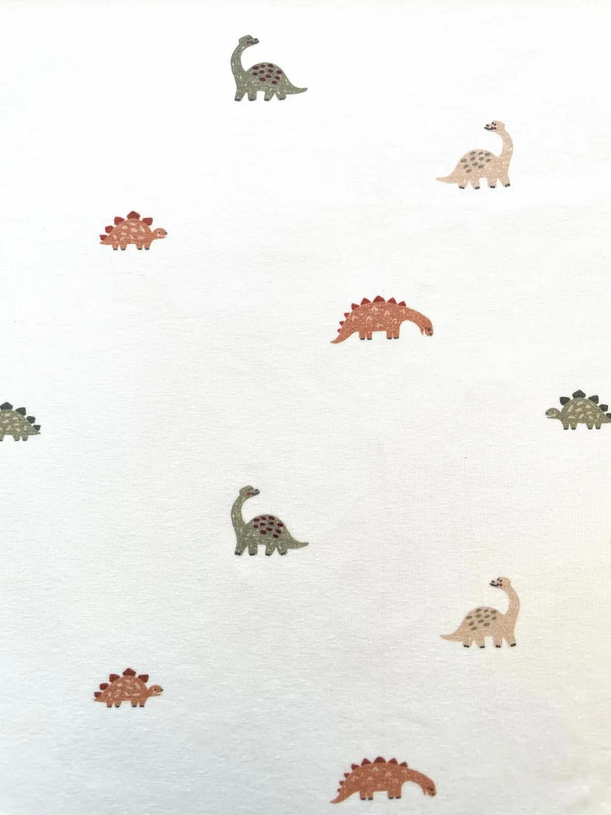 Baumwolljersey: Kleine Dinos auf Creme Baumwolljersey: Kleine Dinos auf Creme