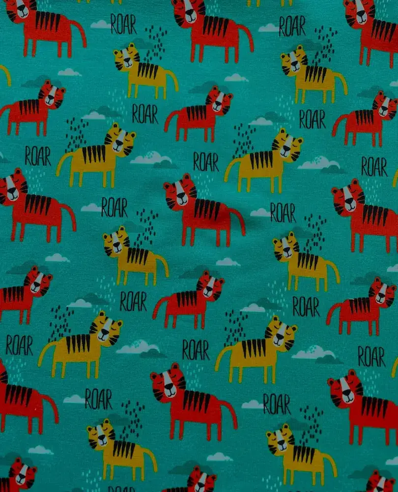 Weicher French Terry Stoff in Petrol mit bunten Tigermotiven für Kinderkleider