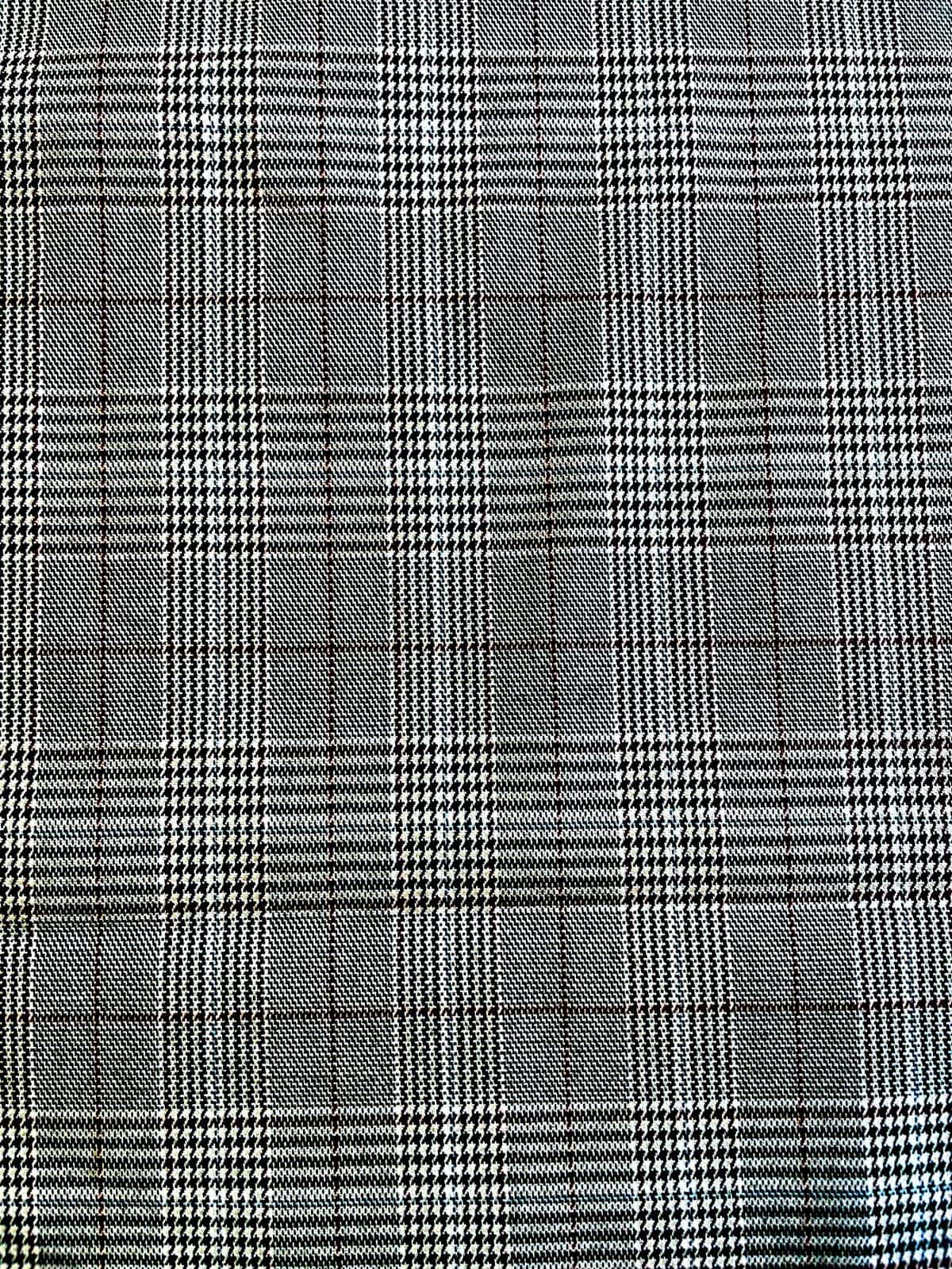 Hochwertiger Karostoff (Scottish Check / Glencheck) als Meterware in Schwarz-Weiß mit klassischem Karomuster für Bekleidung und Heimtextilien.